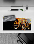 28x12 inches mouse pad showcasing Eren, Mikasa, and Armin soaring into battle with flames, capturing their unstoppable will.