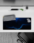 Moody deep navy and smoky blue desk mouse pad with calm stormy glow, 28x12 inches.