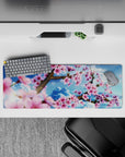 Intense 32x12 desk mat features cherry blossoms and bright sky with intricate details for fans of tranquility