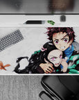 Tanjiro and Nezuko Demon Slayer anime desk pad, 40x20 inches, capturing sibling bond, protection, and fierce loyalty.