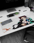 Tanjiro and Nezuko Demon Slayer desk pad 36x16 inches, featuring vivid anime characters with emotional intensity on canvas.