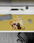 Demon Slayer desk pad 36x16 inches featuring Zenitsu mid-strike with lightning, yellow haori on a golden background.
