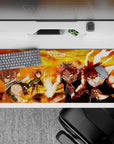 Fiery orange-and-black anime desk pad 36x16 inches, ember glow, sharp shadows, intense battle vibe.