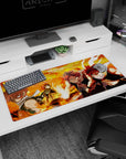 Natsu Dragneel scarf fluttering, fists raised in flame-filled scene on 36x16 inches anime desk pad.