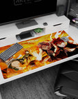 Natsu Dragneel battle-ready with fluttering scarf and clenched fists anime desk pad 40x20 inches.