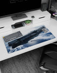 Sleek starship drifting above a blue frozen world scene on desk mouse pad, 32x16 inches.