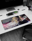 32x16 inches Violet Evergarden mouse pad with her sharp blue eye against a gray sky and falling embers.