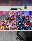 40x20 inches anime desk pad in teal, violet, and candy pink; high-energy cute chaos concert vibe.
