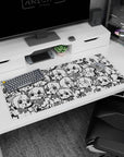 36x16 inches desk pad packed with chibi anime girls’ big eyes and loud expressions in a crowded doodle scene.
