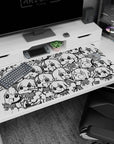 40x20 inches desk pad covered in repeating chibi anime girls with big eyes and expressive faces.