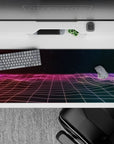 Striking 36x16 desk pad highlights glowing gridlines, starry skies, and vibrant gradients in stunning detail