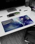 Kirito anime mouse pad, size 32x16 inches, depicts intense energy as Kirito dives forward, blade first, amidst icy blues and light.