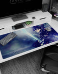 Anime desk pad featuring Kirito in action from Sword Art Online, size 40x20 inches, with dynamic icy blue tones.