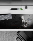36x16 inches grayscale anime desk pad, moody rain haze with charcoal-to-mist fade and thin red slashes.