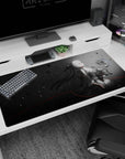 40x20 inches desk pad showing white-bob android girl with long ribbons holding a plush bunny in rainy petals.