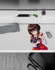 Cozy anime desk pad 36x16 inches in white with warm glowing eyes, red and gold trim accents.