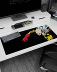 36x16 inches One Punch Man desk pad showing Saitama rocketing forward, cape snapping, fist in focus.
