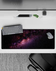 Calming purple and blush nebula on inky black 32x12 inches mouse pad with stardust sparkle.