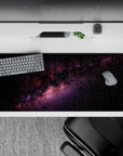 Calming inky black desk pad 36x16 inches with purple and blush nebula and stardust sparkle texture.