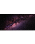 Galaxy night-sky desk pad 36x16 inches with speckled stars and swirling nebula design.