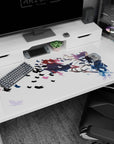 Purple-haired anime archer on desk pad 40x20 inches, cape sweeping like paint on white backdrop.