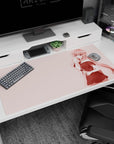 Shy smiling anime girl holding a knife in pastel pink scene desk pad, 40x20 inches.