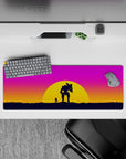 Bold 32x12 mouse pad with a sunset battle scene, a lone figure, and a mech companion set against pink, orange, and purple for epic energy