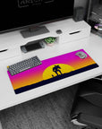 Adventure-inspired 32x12 mouse pad featuring a lone figure and mech silhouetted against stunning sunset hues for a peaceful yet bold vibe