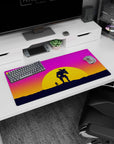 Vibrant 32x16 mouse pad with a silhouetted figure and mech against stunning sunset hues of pink, orange, and purple for an adventurous vibe