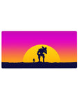 Sunset battle 32x16 mouse pad with a lone figure and mech companion silhouetted against pink, orange, and purple hues for a bold, vibrant atmosphere