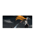 Mouse pad featuring Hollow Ichigo, 28x12 inches, with orange hair, bone mask, and black sword for a menacing look.
