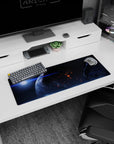 Glowing planet in deep space mouse pad 32x12 inches, ember-like orange flickers on a dark sky.