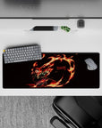 Tanjiro from Demon Slayer on a 32x12 inch mouse pad; fiery dance with glowing red eyes and vibrant flame ring against black.