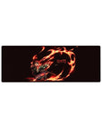 Tanjiro in fiery action on a 32x12 inch Demon Slayer anime mouse pad, showcasing vivid reds and oranges against a deep black background.