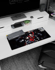 Sharp-eyed girl in crimson blazer reaching out, ribbon-like black hair, anime mouse pad 28x12 inches.