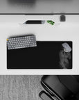 Moody grayscale anime girl mouse pad 28x12 inches with calm, teasing vibe and bright blue eyes.