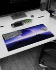 Giant moon over shadowy mountains mouse pad 32x16 inches under a quiet alien dawn sky with speckled stars.