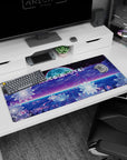Artistic 36x16 inches desk pad featuring synthwave design, blending glowing flower patterns, a futuristic grid, soft moon, and "愛してる" for cosmic beauty.