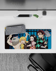 28x12 inches mouse pad showcasing Tanjiro, Nezuko, Zenitsu, and Inosuke, embodying the fierce spirit of the Demon Slayer squad.