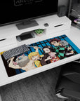 Artistic 36x16 inches desk pad with Tanjiro, Nezuko, Zenitsu, and Inosuke, showcasing their strength and vibrant colors from Demon Slayer.