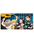 Mouse pad featuring Tanjiro, Nezuko, Zenitsu, and Inosuke, 32x16 inches, bringing their bold colors and dynamic energy from Demon Slayer.