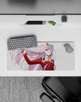 28x12 inches mouse pad with Zero Two from Darling in the Franxx, exuding confidence and motion as her pink hair flows in the wind.