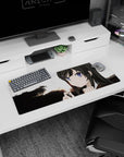 Anime girl with sharp purple eyes at sunset mouse pad 32x12 inches, bold tree silhouettes behind her.