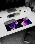 Anime mouse pad 28x12 inches showing a silhouetted hero with wild hair and moon-glow eyes in a purple storm.