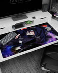 Itachi Uchiha drops into Akatsuki pose, sharp eyes and flaring cloak on anime desk pad 40x20 inches.