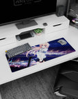 32x12 inches mouse pad showing shy blue-eyed anime girl, windblown peach hair, lights and ferris wheel behind.