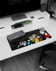 Okabe in red-black with Kurisu and Mayuri center, gears behind, anime mouse pad 28x12 inches.