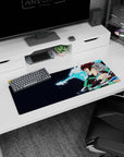 Tanjiro from Demon Slayer on a 32x12 inch mouse pad, showcasing his water dragon attack with vibrant colors and dynamic design.