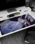 Two horned anime girls lounging on a sleek silver car desk pad 40x20 inches, glossy shadows and chaos.