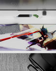 36x16 inches black and red anime desk pad, glossy crimson blade, orange accents, fierce high-energy vibe.